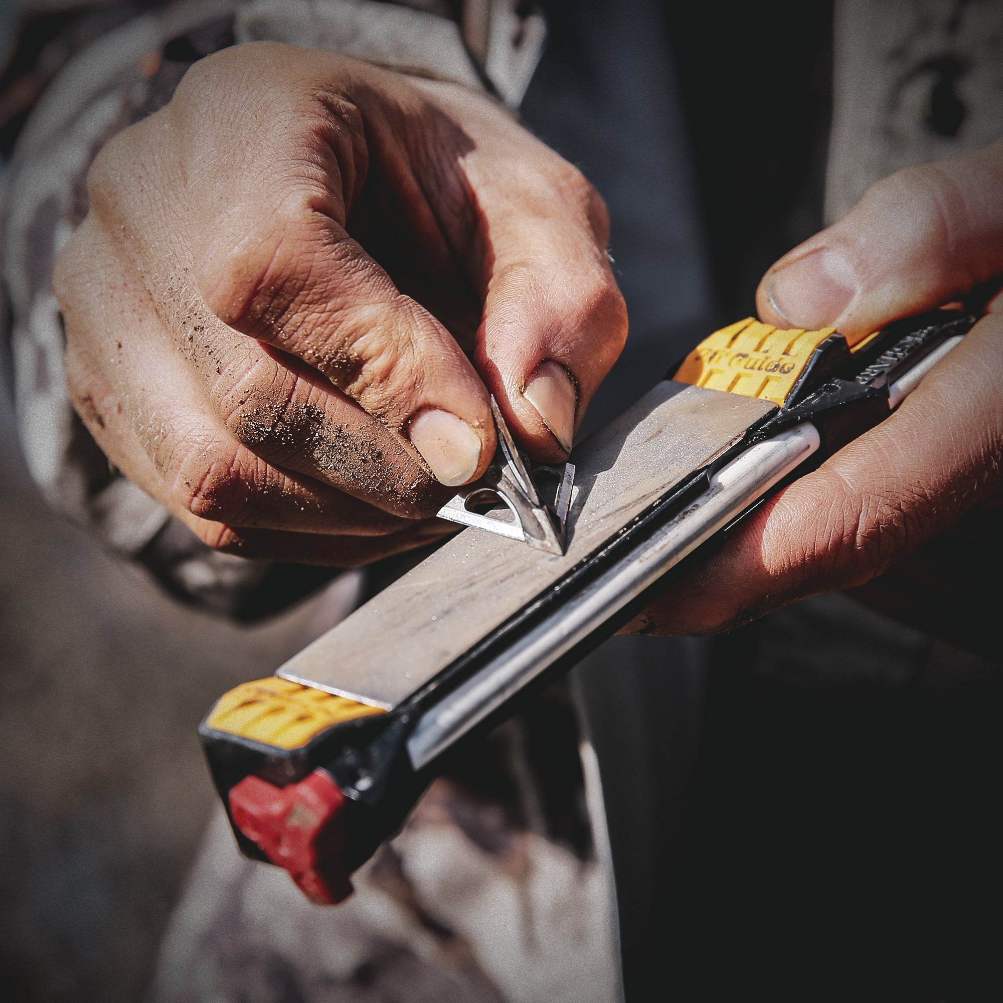 Worksharp Guided Field Sharpener sharpening a hunting broadhead